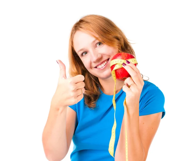 Portrait of a young sport woman holding apple and measuring tape — Stock Photo, Image
