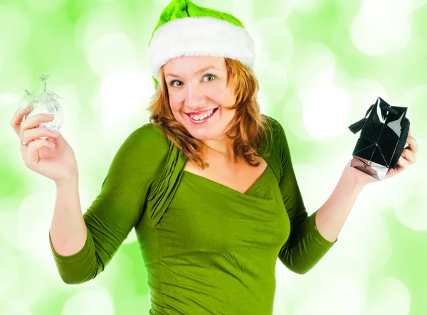 Beautiful happy woman looking inside black shopping gift bag looking surprised — Stock Photo, Image