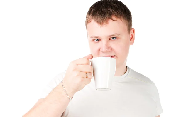 Young man drinking a cup — Stock Photo, Image
