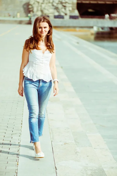 Portrait of a beautiful european woman smiling outdoors — Stock Photo, Image