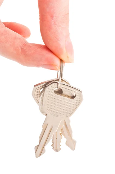 Human hand with keys on white — Stock Photo, Image