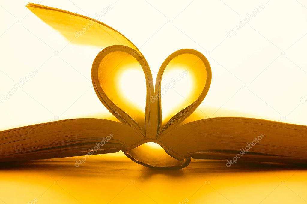 pages of book curved into heart shape