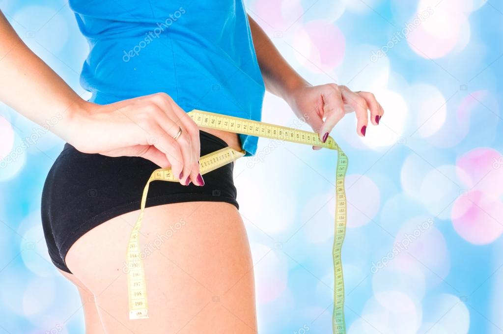 woman diet concept with measuring tape