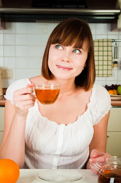 Young beautiful happy woman with tea — Stock Photo, Image