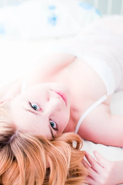 Sexy blond woman lay on bed in lingerie — Stock Photo, Image