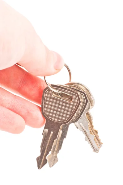 Human hand with keys on white — Stock Photo, Image