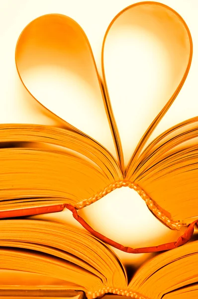 Pages of book curved into heart shape — Stock Photo, Image