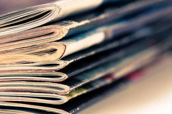 A large stack of magazines piled high.