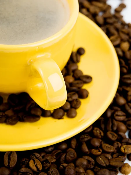 黄色のカップにコーヒー ロイヤリティフリーのストック画像