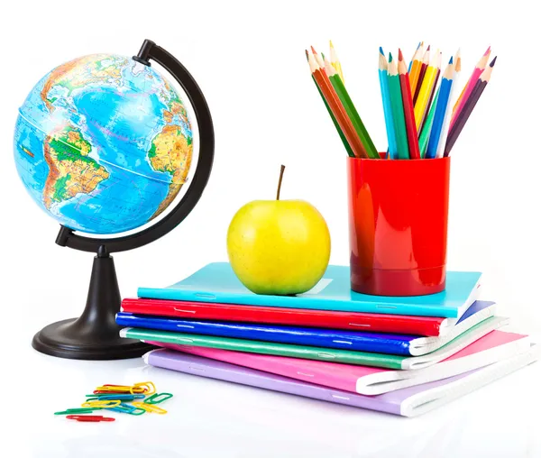 Globe, notebook stack and pencils. — Stock Photo, Image