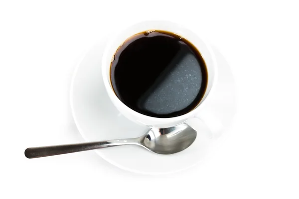 Taza de café y cuchara sobre fondo blanco — Foto de Stock