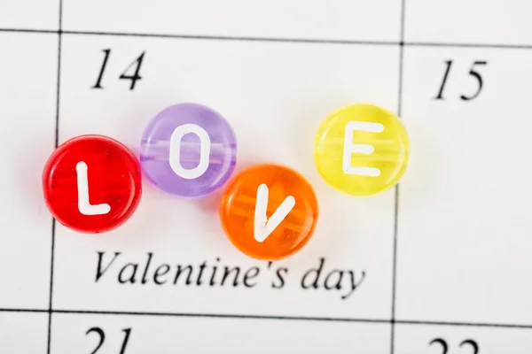 Calendar page with LOVE on February 14 of Saint Valentines day. — Stock Photo, Image