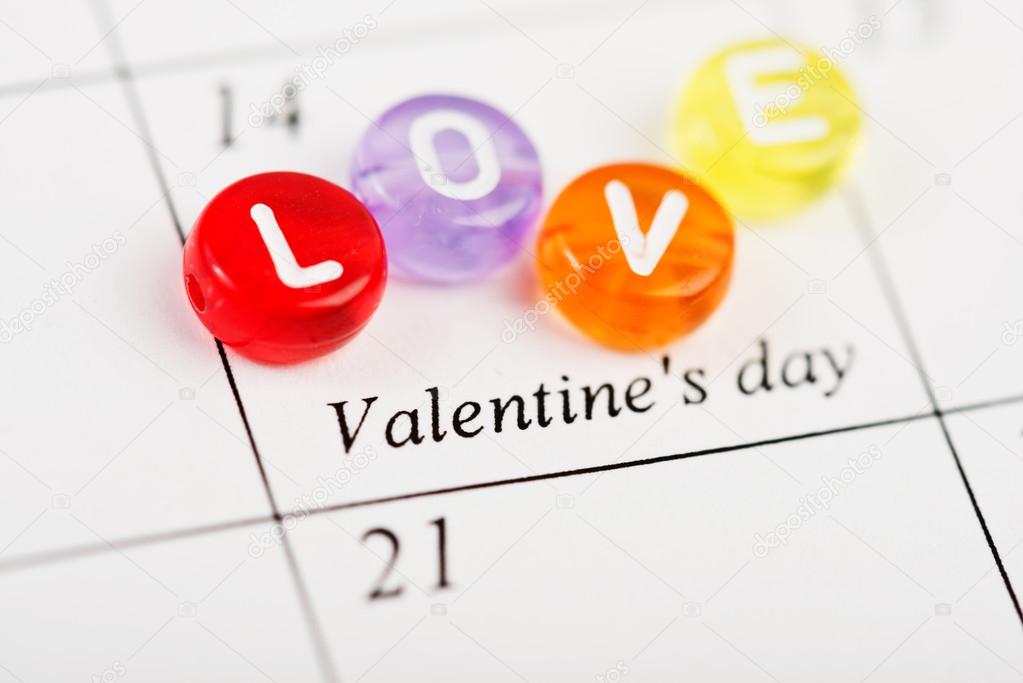Calendar page with LOVE on February 14 of Saint Valentines day.