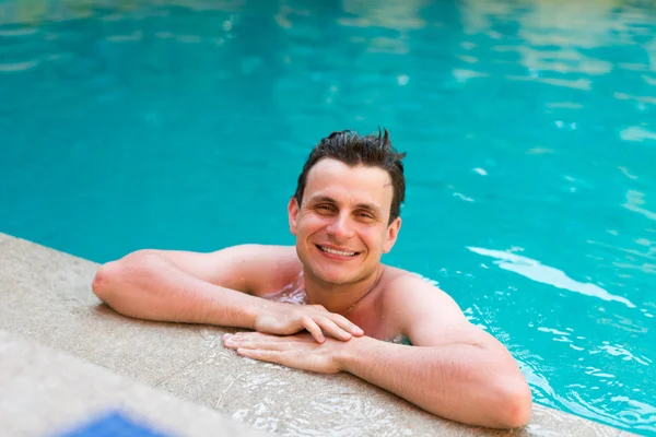 Man posing in the swimming pool — Stock Photo, Image