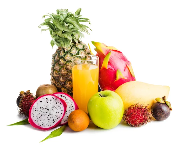 Juice in glass and tropical fruit — Stock Photo, Image