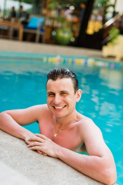 Man posing in the swimming pool — Stock Photo, Image