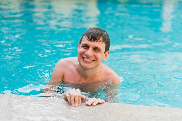 Man posing in the swimming pool — Stock Photo, Image