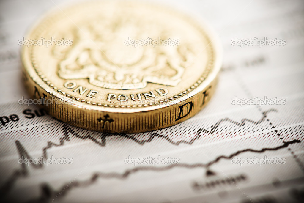 one pound coin on fluctuating graph