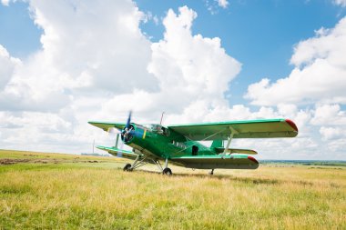 old airplane on green grass  clipart