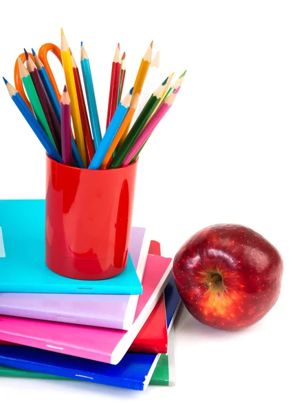 Notebooks, pencils and apple. — Stock Photo, Image