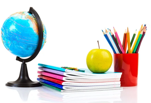 Globe, notebook stack and pencils. — Stock Photo, Image