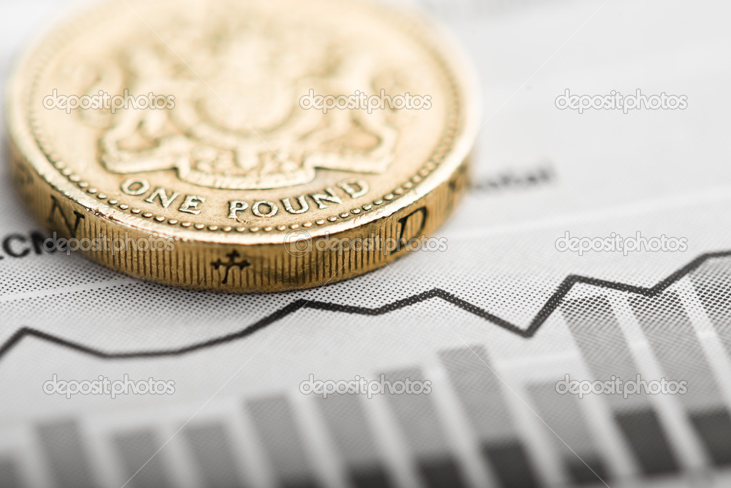 One pound coin on fluctuating graph.