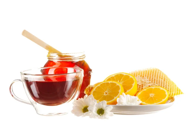 Pot met honing en thee beker — Stockfoto