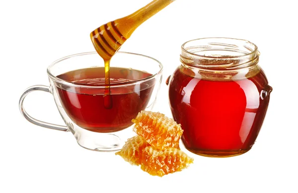 Jar of honey and tea cup — Stock Photo, Image