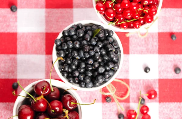 Wild berries in bowls