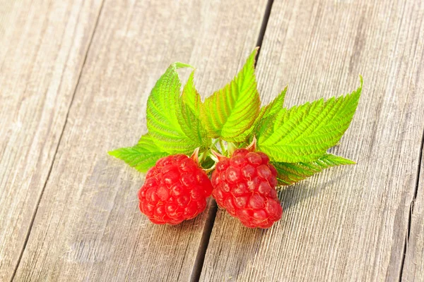 Raspberry on wooden table — Stock Photo, Image