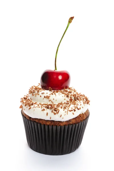 Cupcake with whipped cream and cherry Royalty Free Stock Images