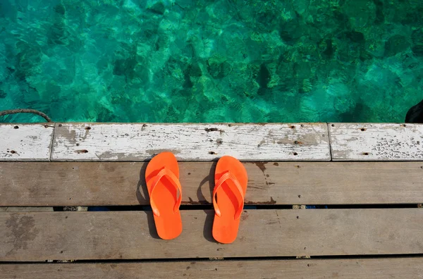 Sandals at jetty — Stock Photo, Image