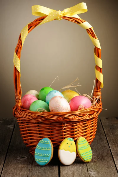 Colored easter eggs in basket — Stock Photo, Image