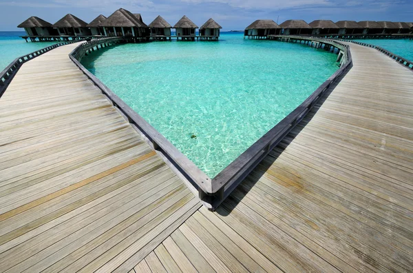 Beautiful beach with water bungalows — Stock Photo, Image