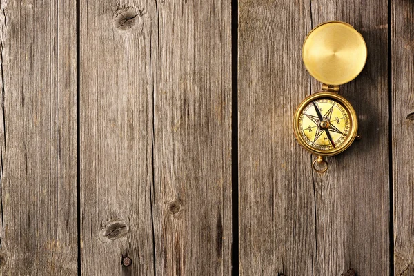 Antique compass over wooden background — Stock Photo, Image