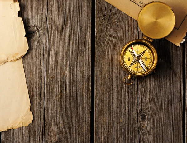 Antique compass over wooden background — Stock Photo, Image