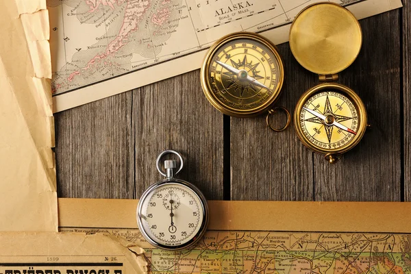 Antique compasses over old map — Stock Photo, Image