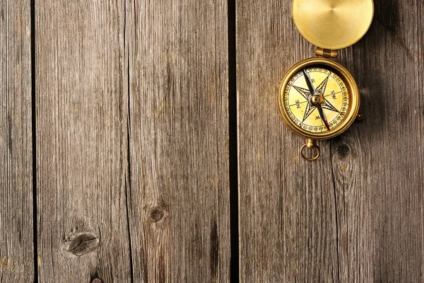 Antique compass over wooden background — Stock Photo, Image