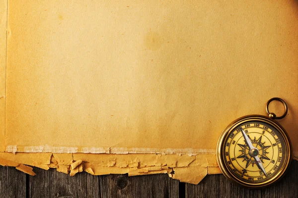 Antique brass compass over old background — Stock Photo, Image