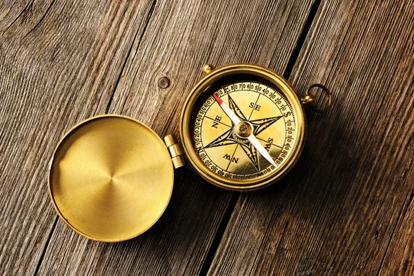 Antique compass over wooden background — Stock Photo, Image