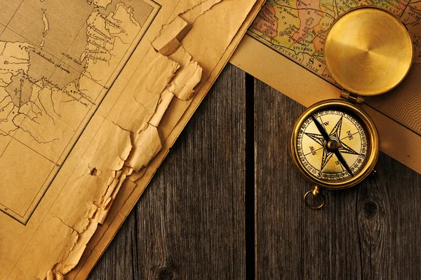 Antique compass over old map — Stock Photo, Image