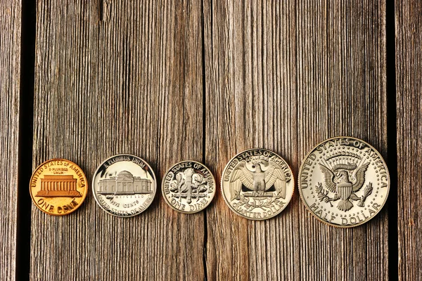 US cent coins over wooden background — Stock Photo, Image