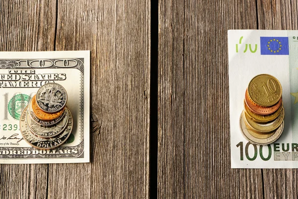 US and euro money over wooden background — Stock Photo, Image