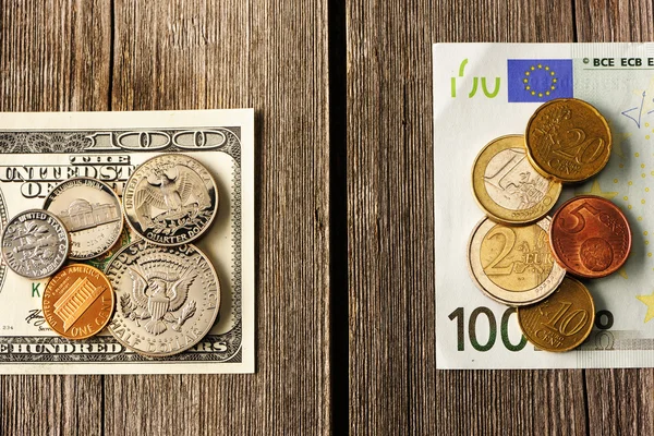 US and euro money over wooden background — Stock Photo, Image