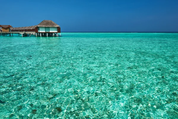 Beautiful beach with water bungalows — Stock Photo, Image