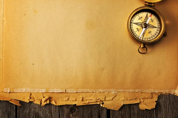 Antique brass compass over old background — Stock Photo, Image