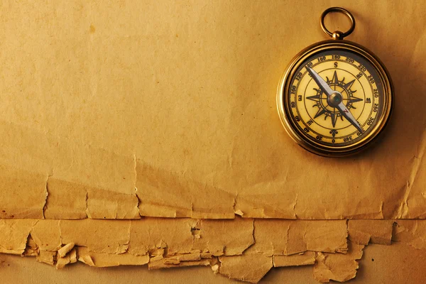 Antique brass compass over old background — Stock Photo, Image