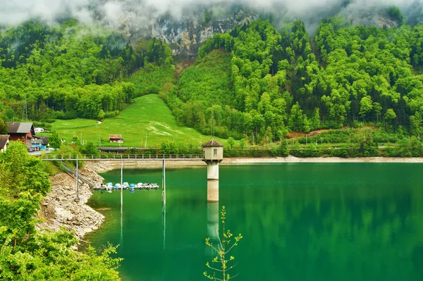 Beautiful emerald mountain lake in Switzerland — Stock Photo, Image