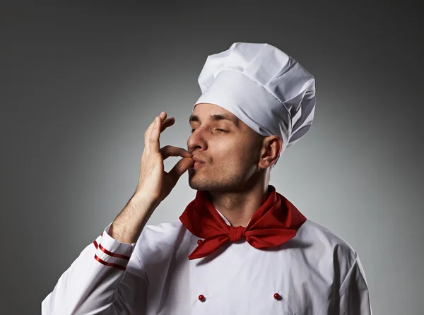 Mannelijke chef-kok zoenen vingers — Stockfoto