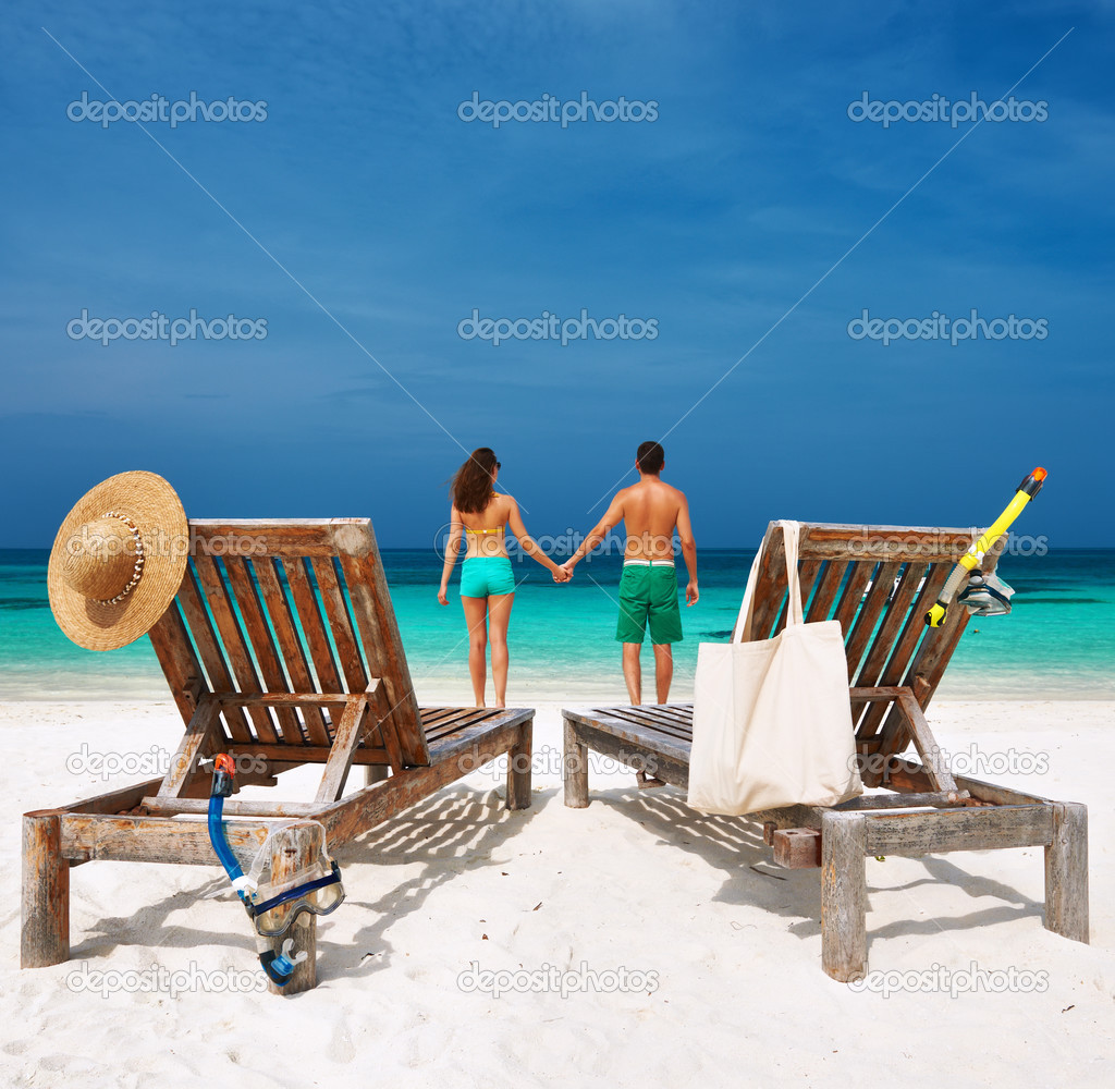 Couple in green on a beach at Maldives